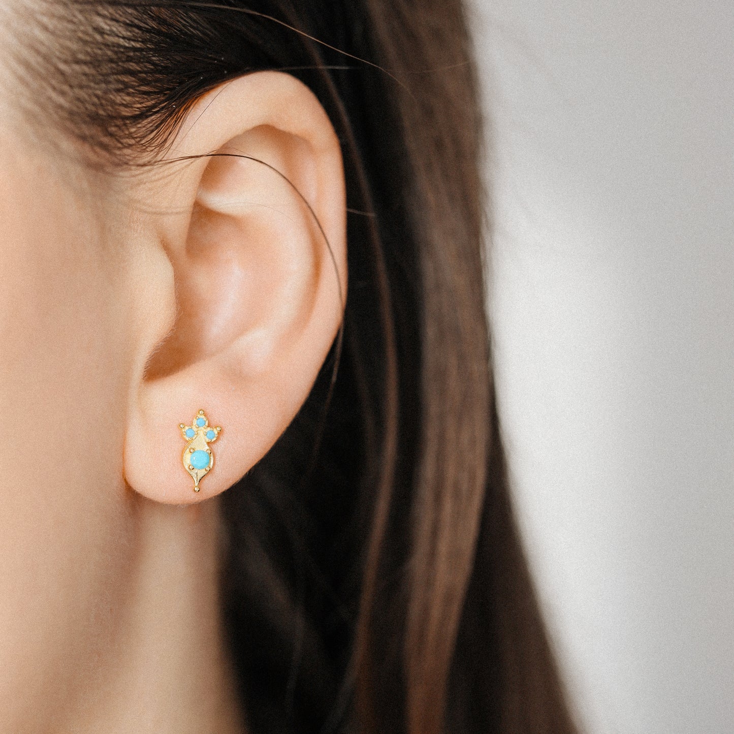 Small turquoise stud earrings with vintage inspired design