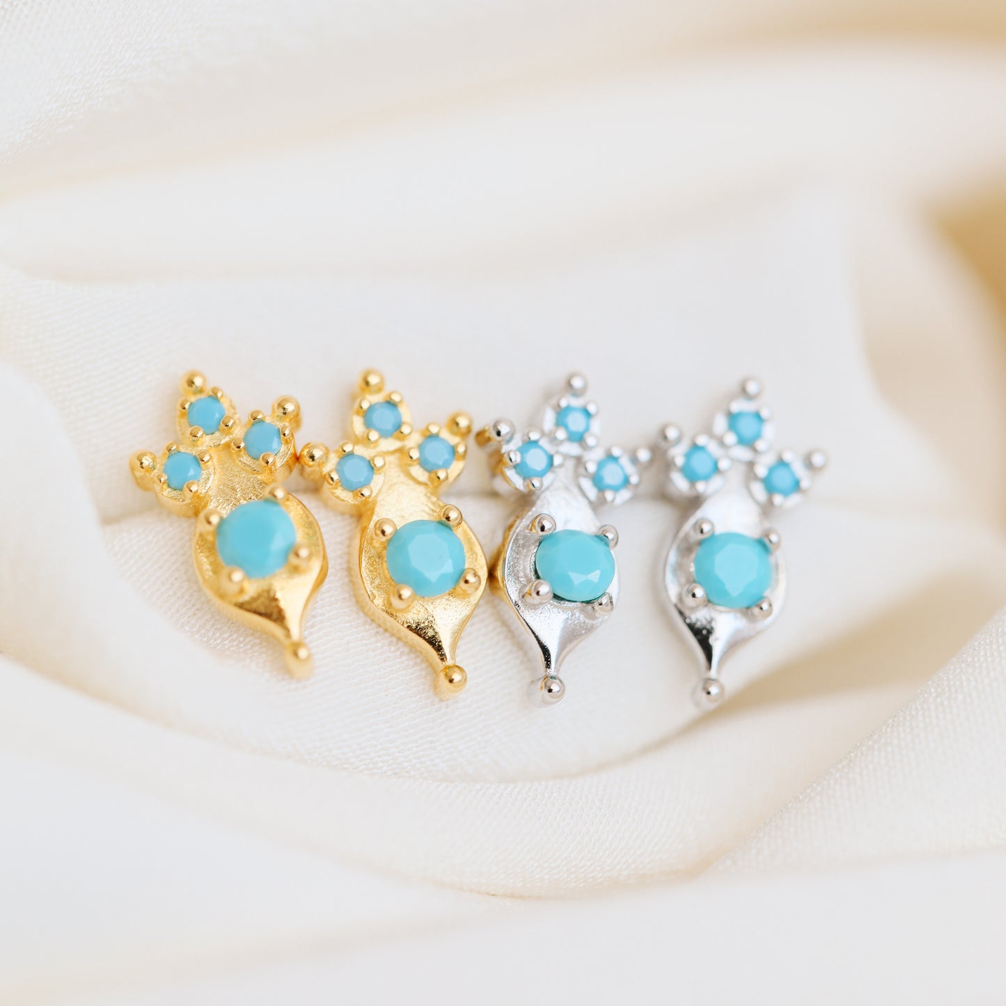 Turquoise gemstone stud earrings in sterling silver and gold finishes