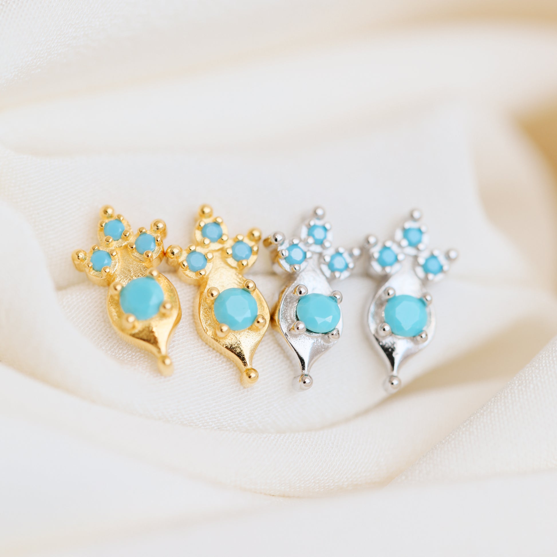 Turquoise gemstone stud earrings in sterling silver and gold finishes