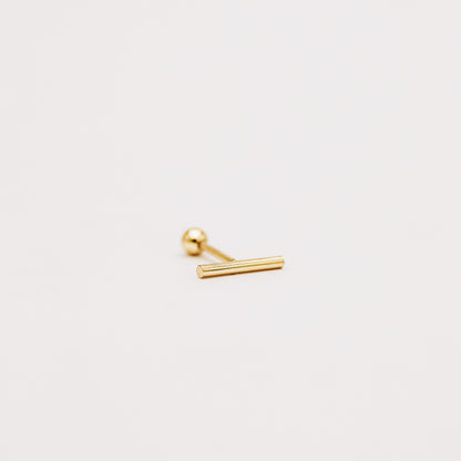 Side view of gold bar screw back earring showing slim minimalist profile