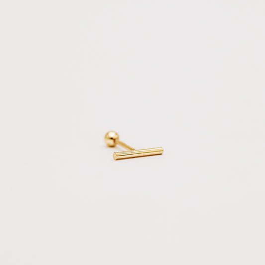 Side view of gold bar screw back earring showing slim minimalist profile