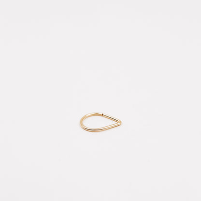Gold filled chevron septum ring with open hoop design on a clean white background.