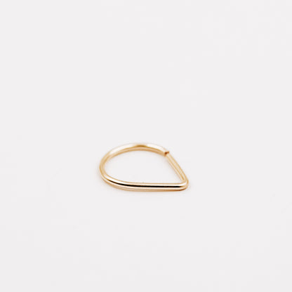 Gold filled chevron septum ring with open hoop design on a clean white background.