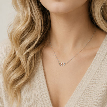 Dainty handcuff necklace worn by model with beige knit sweater