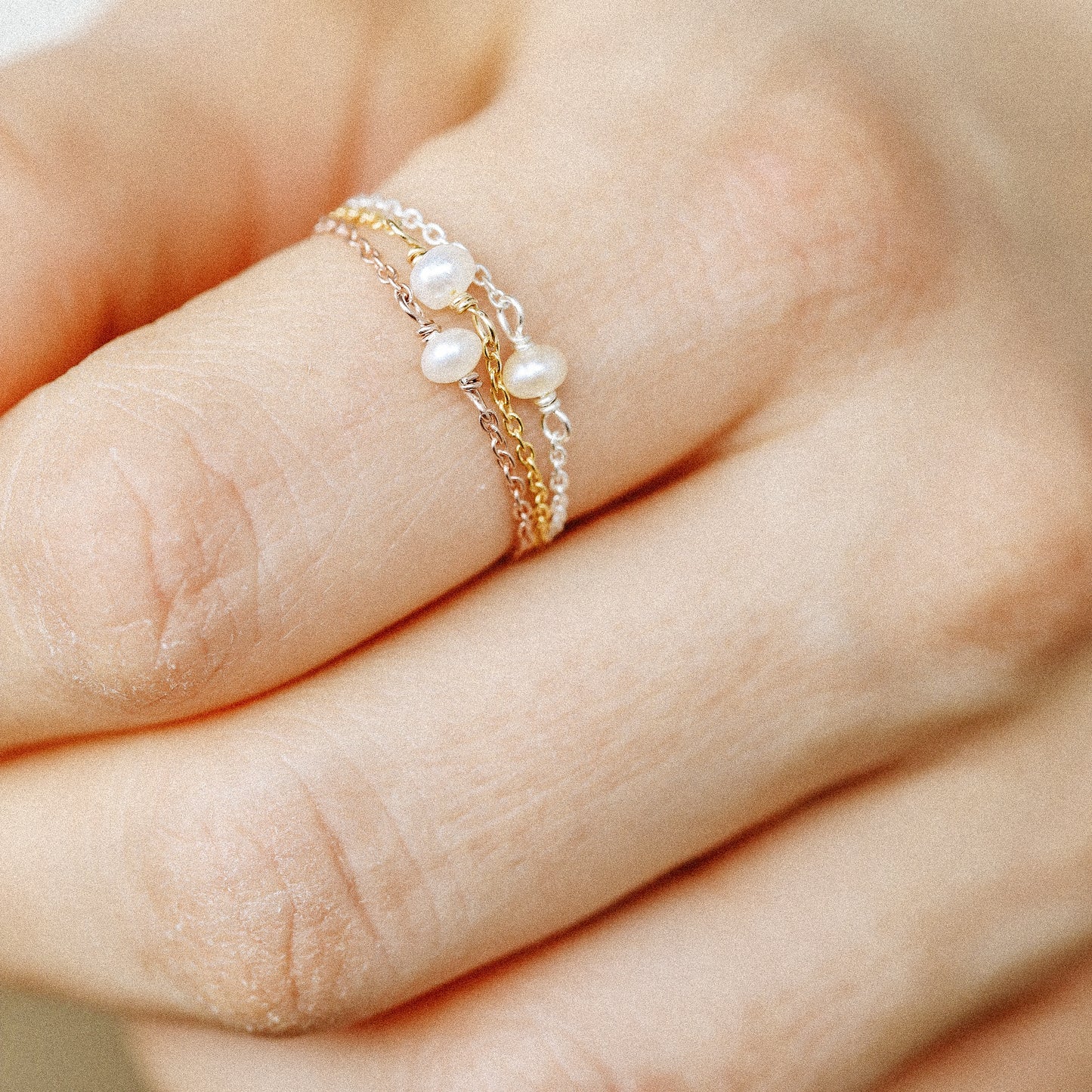 Minimal freshwater pearl chain ring worn on hand