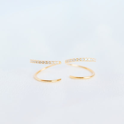 Lightweight gold twist hoop earring worn on ear