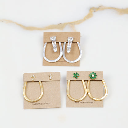 Selection of gold and silver teardrop ear jacket backs displayed with different stud styles to illustrate possible styling combinations.
