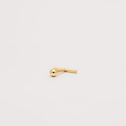 Gold bar earring showing secure screw back closure detail