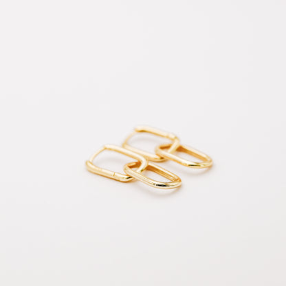 Pair of gold double open-link hoop earrings displayed on white background