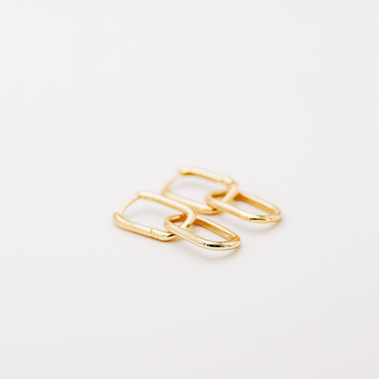 Pair of gold double open-link hoop earrings displayed on white background