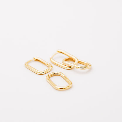 Gold hinged hoop earrings showing the polished double link construction