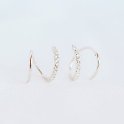 Lightweight gold twist hoop earring worn on ear