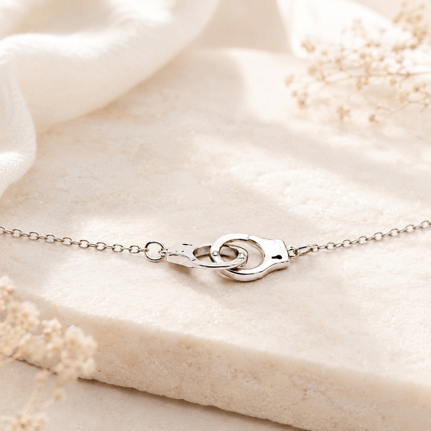 Dainty handcuff necklace worn as everyday symbolic jewelry