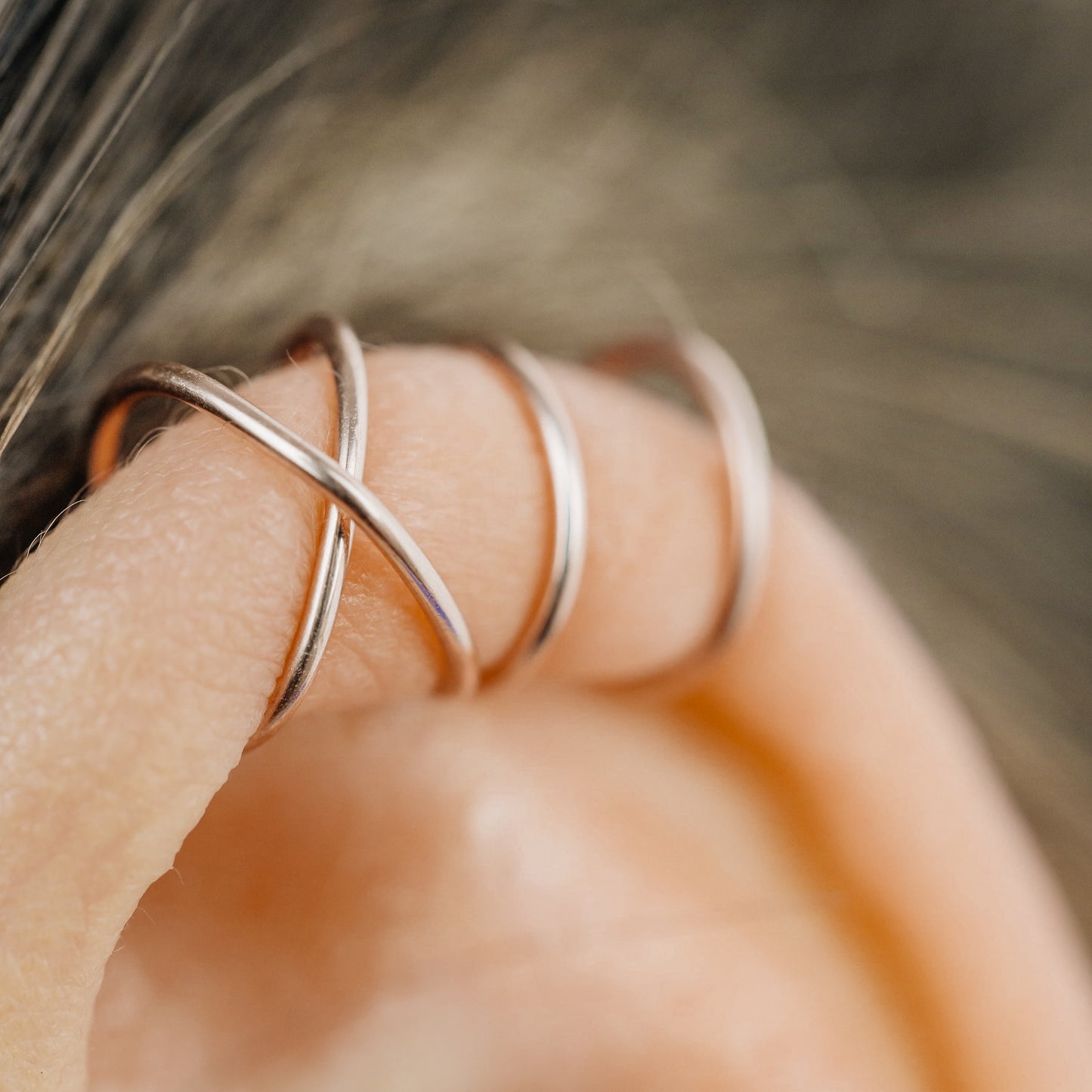 No-piercing double line and criss cross helix ear cuff shown on the upper ear, with smooth and diamond cut finish options for cartilage styling.