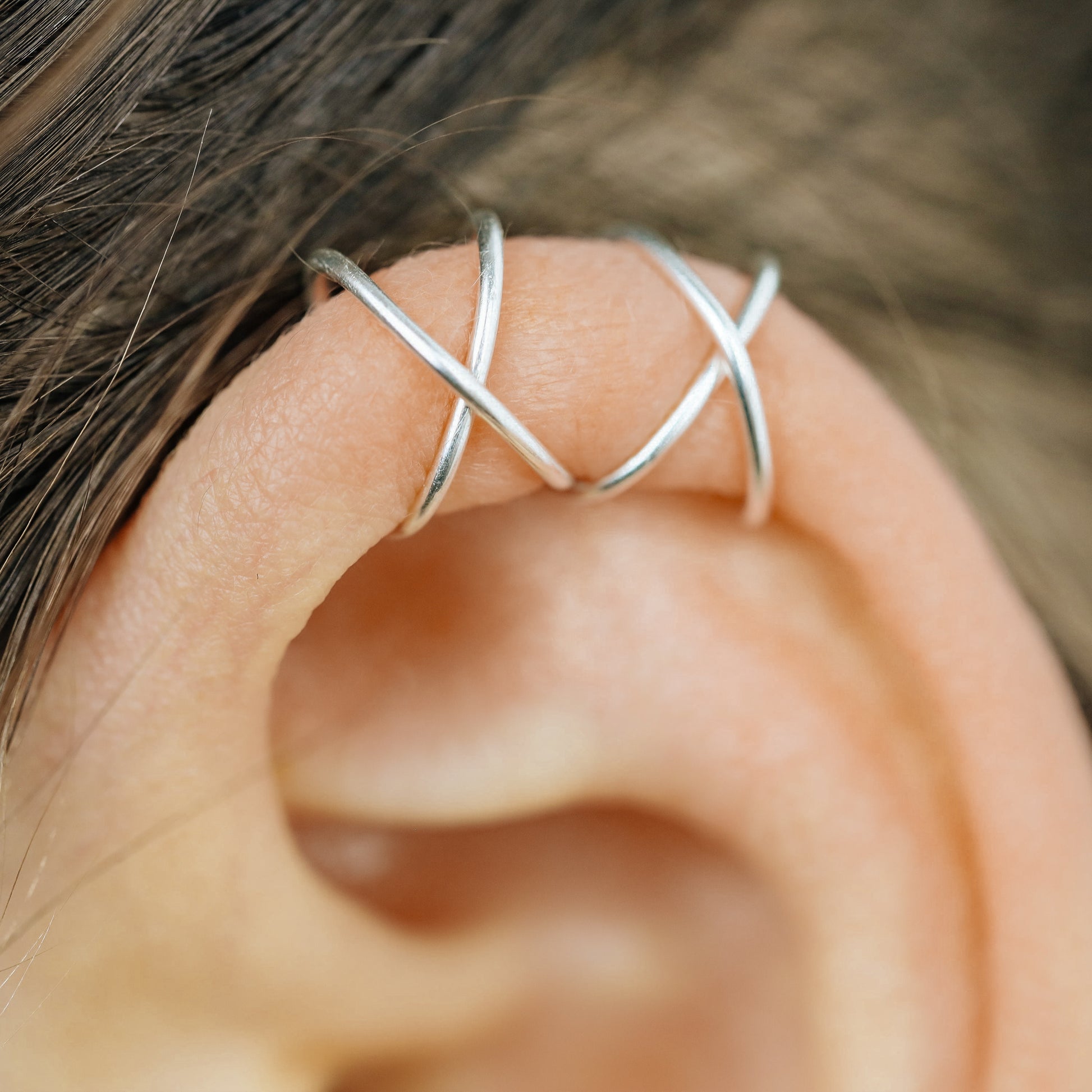 Handmade set of gold criss cross and double line helix ear cuffs for non-pierced ears, adjustable minimalist jewelry available in 12k gold filled, sterling silver, and 16 gauge black aluminum.