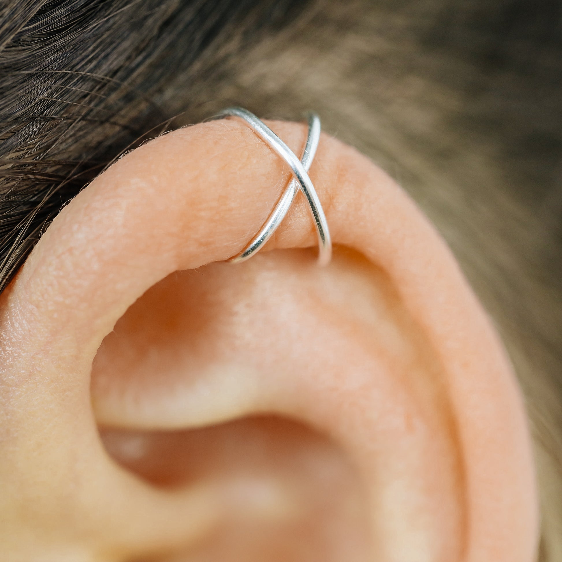 Handmade set of gold criss cross and double line helix ear cuffs for non-pierced ears, adjustable minimalist jewelry available in 12k gold filled, sterling silver, and 16 gauge black aluminum.
