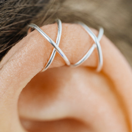 Handmade set of gold criss cross and double line helix ear cuffs for non-pierced ears, adjustable minimalist jewelry available in 12k gold filled, sterling silver, and 16 gauge black aluminum.
