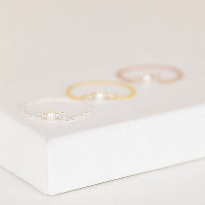 Sterling silver freshwater pearl chain ring displayed on white background