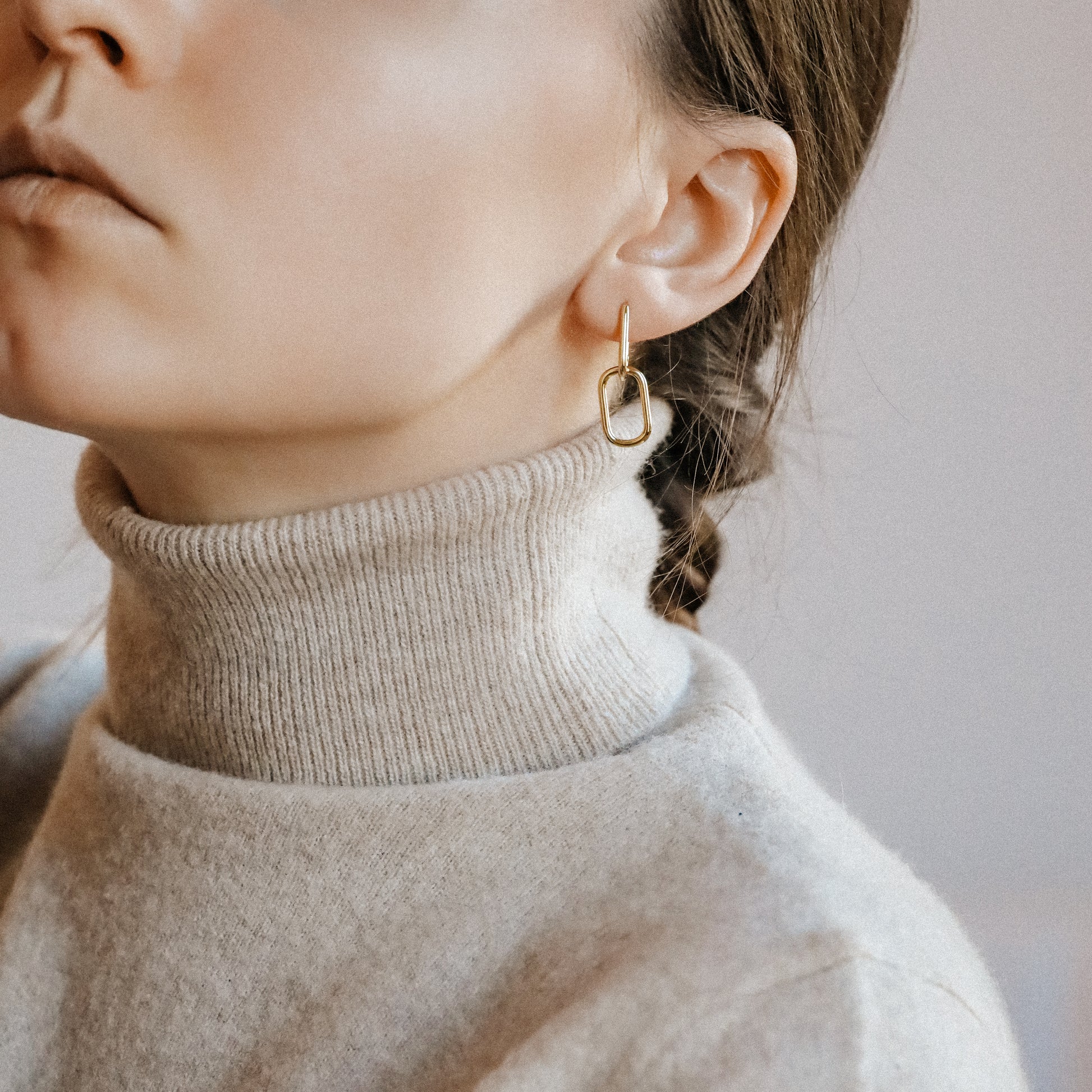 Gold double link hoop earrings styled for lightweight everyday wear