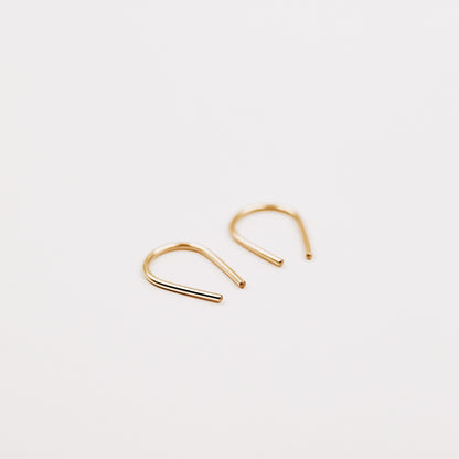 Gold filled U shape earrings displayed on white background