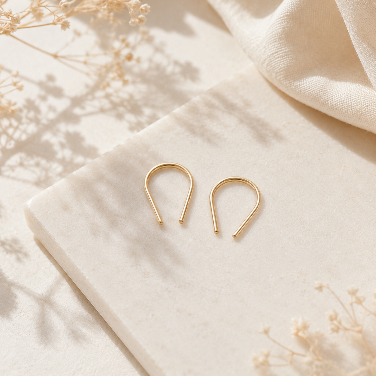 Gold filled U shape earrings featuring a modern geometric silhouette