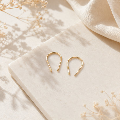 Gold filled U shape earrings featuring a modern geometric silhouette