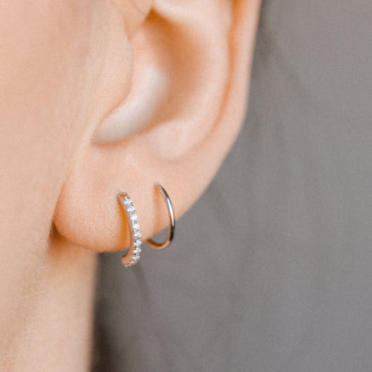Layered ear illusion earring with sparkling cubic zirconia
