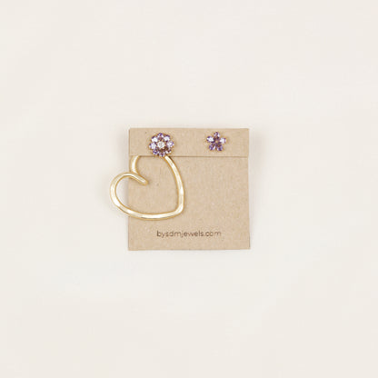 One handmade gold Heart Ear Jacket displayed with decorative flower stud earrings, illustrating the One Ear Jacket option and asymmetric styling possibility.