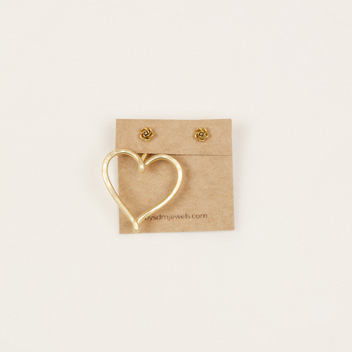 One gold Large Heart Ear Jacket displayed with small rose-shaped stud earrings, illustrating the One Ear Jacket option and asymmetric styling possibility.