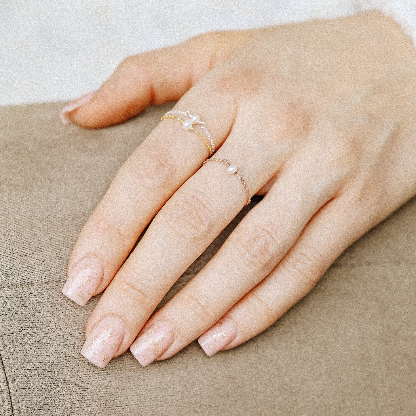Freshwater pearl chain ring styled on hand for everyday wear