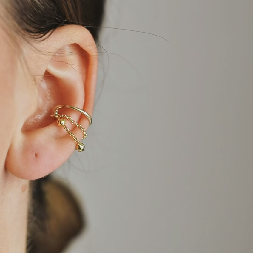 Gold beaded chain ear cuff worn on the conch with double draped chain detail