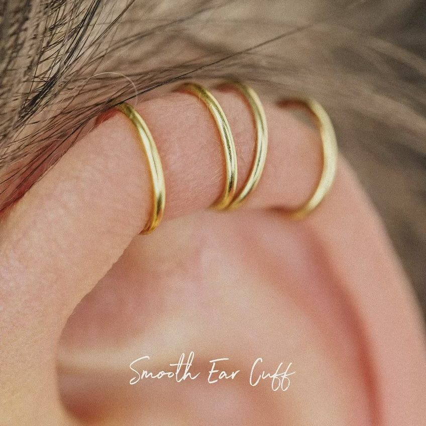 No-piercing double line and criss cross helix ear cuff shown on the upper ear, with smooth and diamond cut finish options for cartilage styling.