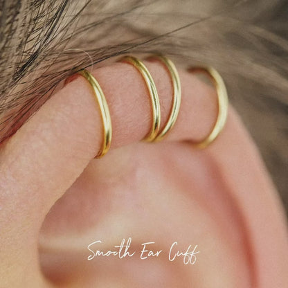 No-piercing double line and criss cross helix ear cuff shown on the upper ear, with smooth and diamond cut finish options for cartilage styling.
