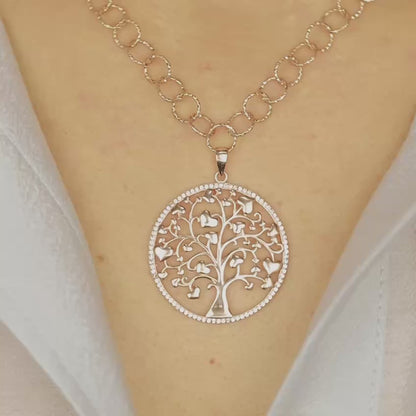 Indulge in luxury with our Tree of Life with Hearts Necklace. Crafted in rose gold, this delicate pendant features a dazzling pave tree of life design, symbolizing family and love. Perfect for Mother's Day, this necklace is a heartfelt gift that will be cherished for years to come.