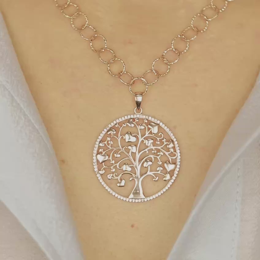 Indulge in luxury with our Tree of Life with Hearts Necklace. Crafted in rose gold, this delicate pendant features a dazzling pave tree of life design, symbolizing family and love. Perfect for Mother's Day, this necklace is a heartfelt gift that will be cherished for years to come.