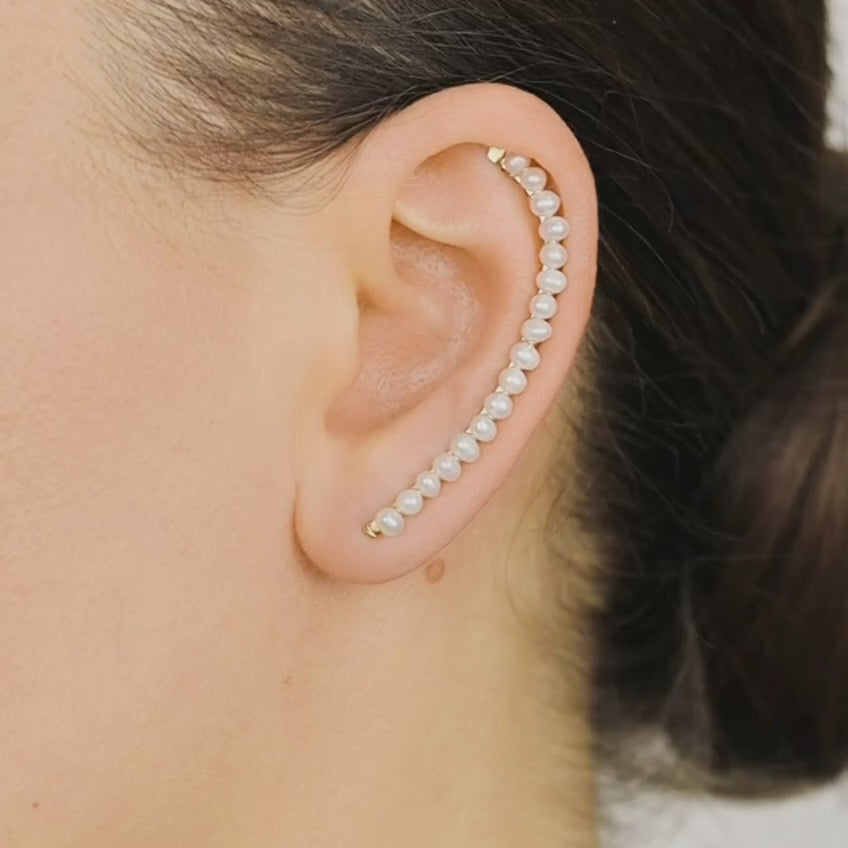 Handmade 50 mm pearl ear climber earrings worn along the natural curve of the ear, featuring tiny 2–3 mm pearls arranged in a delicate climbing design for one standard lobe piercing, available as a pair, single left ear climber or single right ear climber in solid 925 sterling silver, 14k gold filled and 14k rose gold filled, with ear climber lengths available from 10mm to 50mm.
