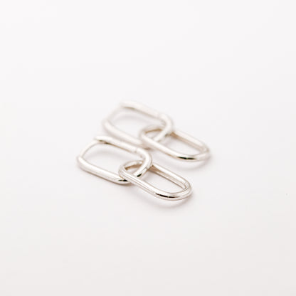 Pair of silver double open-link hoop earrings displayed on white background