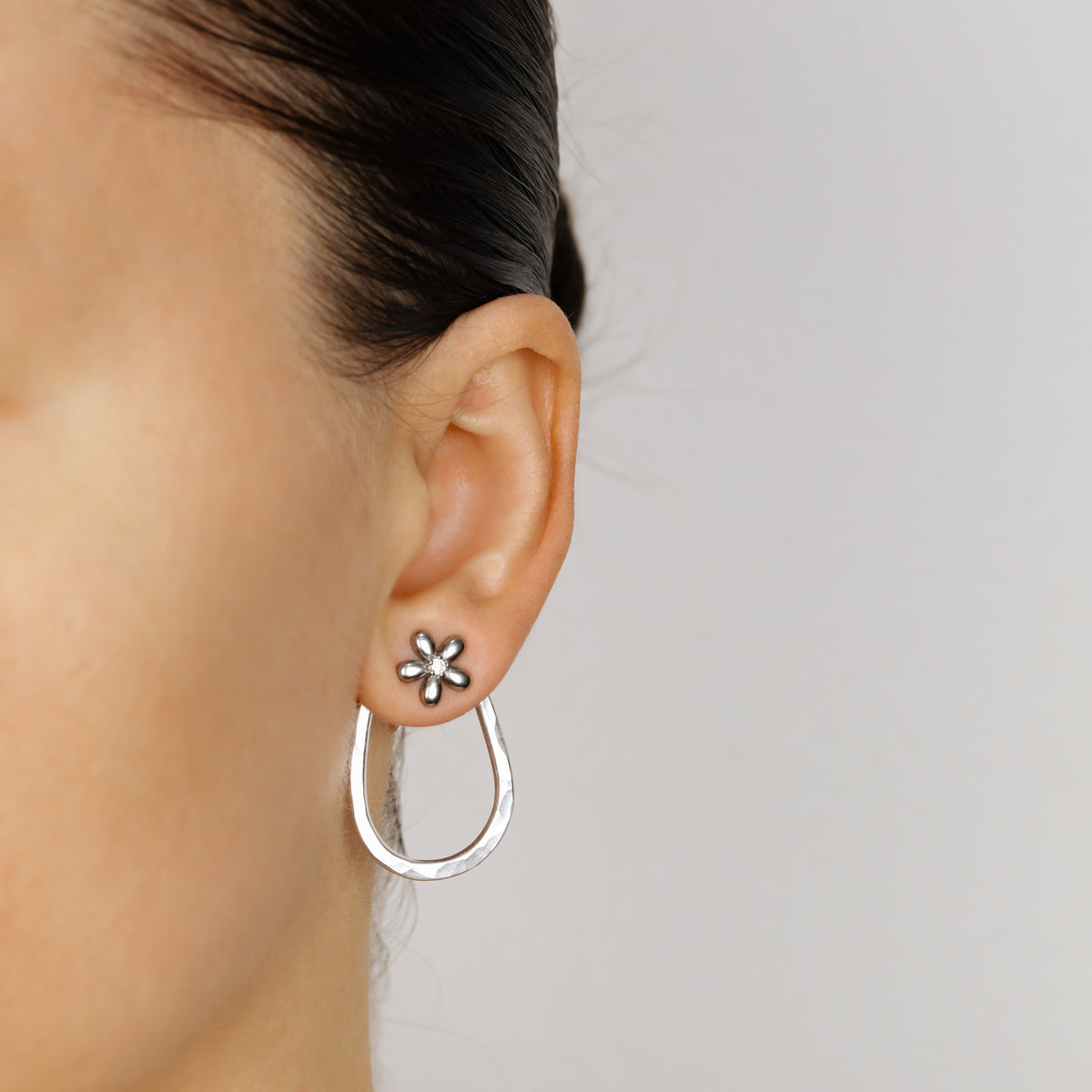 Pair of silver hammered teardrop ear jacket backs displayed with decorative crystal studs, showing the matching Pair configuration.