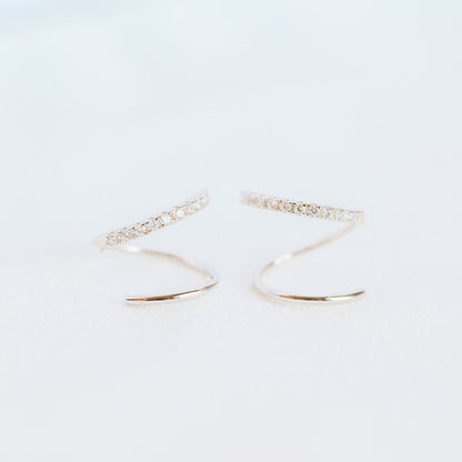 Lightweight gold twist hoop earring worn on ear