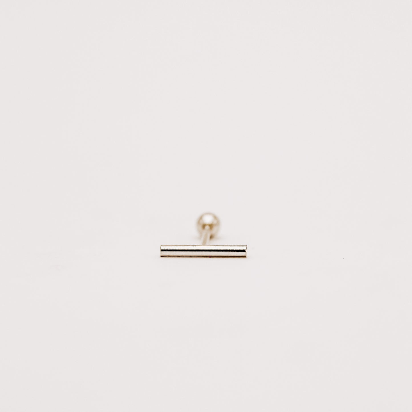 Thin bar screw back earring designed for comfortable daily wear