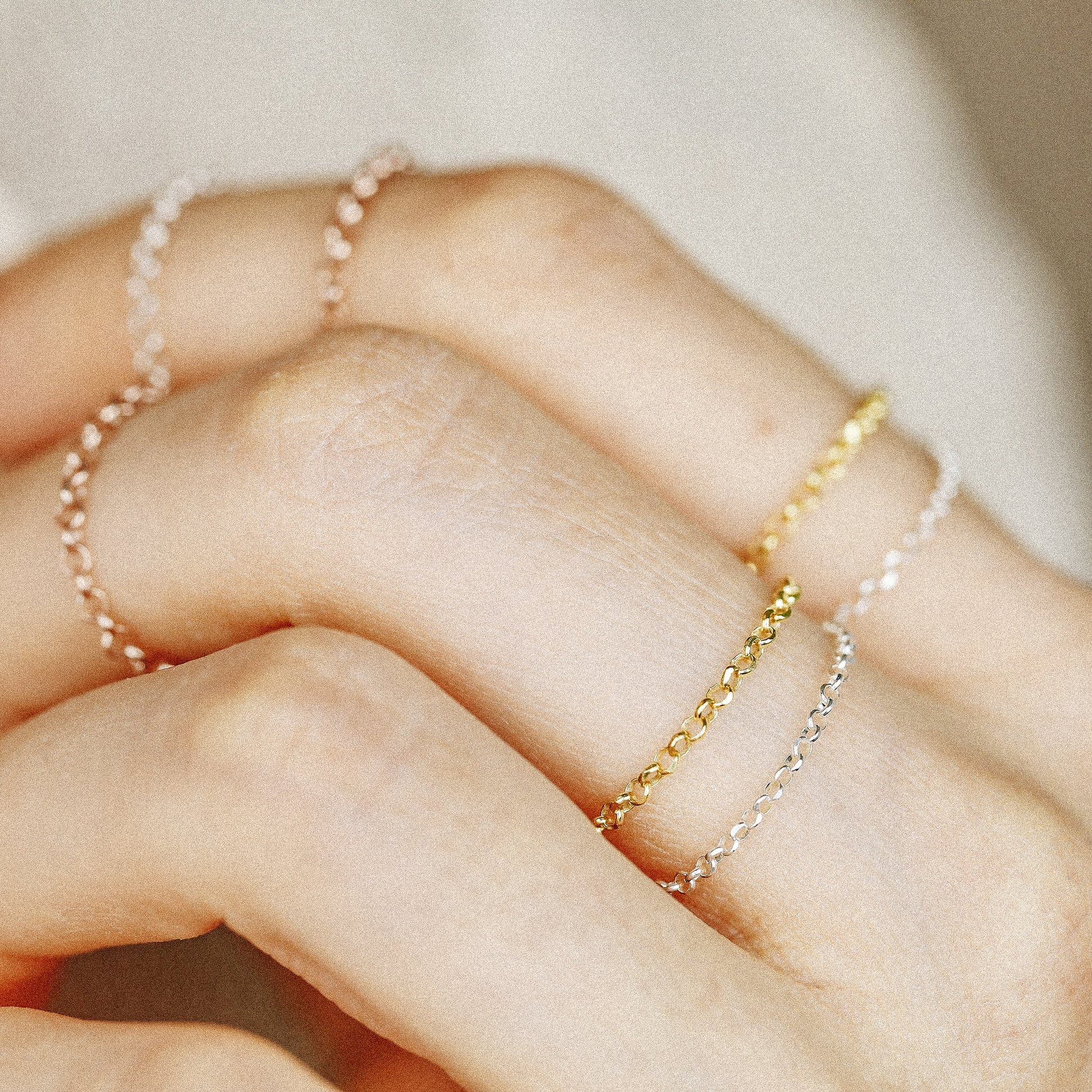 Close up of layered chain rings in mixed metal finishes
