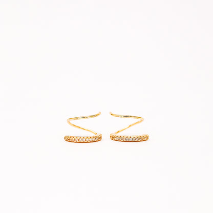 Lightweight gold twist hoop earring worn on ear