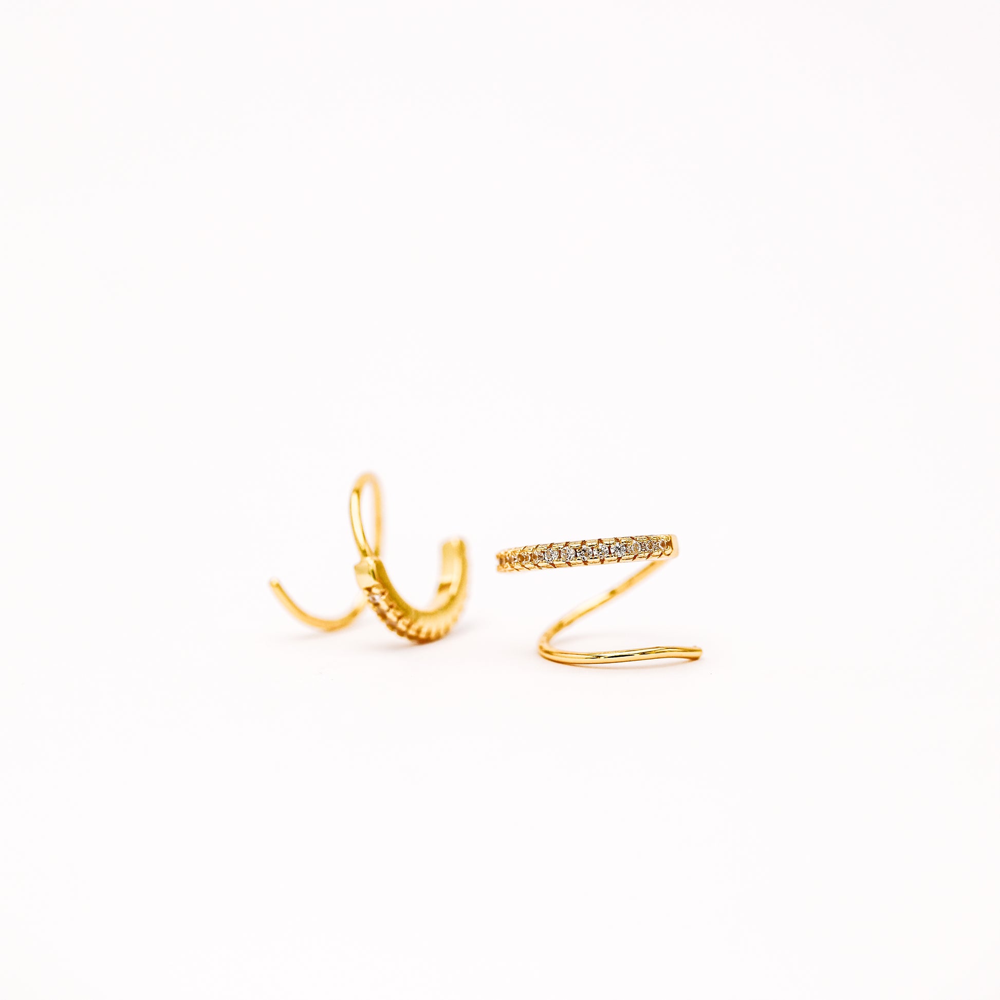 Single piercing double hoop illusion huggie earring close up